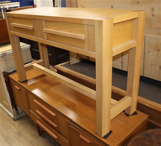 A modern two door oak two drawer side table W.122cm